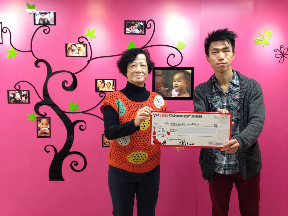 Charity project presentation with a pink background; donation amount concealed